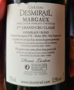 Nhãn sau chai vang Pháp Château Desmirail Margaux ghi dòng Mis en bouteille au château kèm tên và địa chỉ người đóng chai